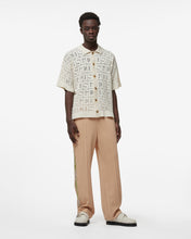 Load image into Gallery viewer, Reflective Print Logo Track Pants : Men Trousers Beige | GCDS Spring/Summer 2023
